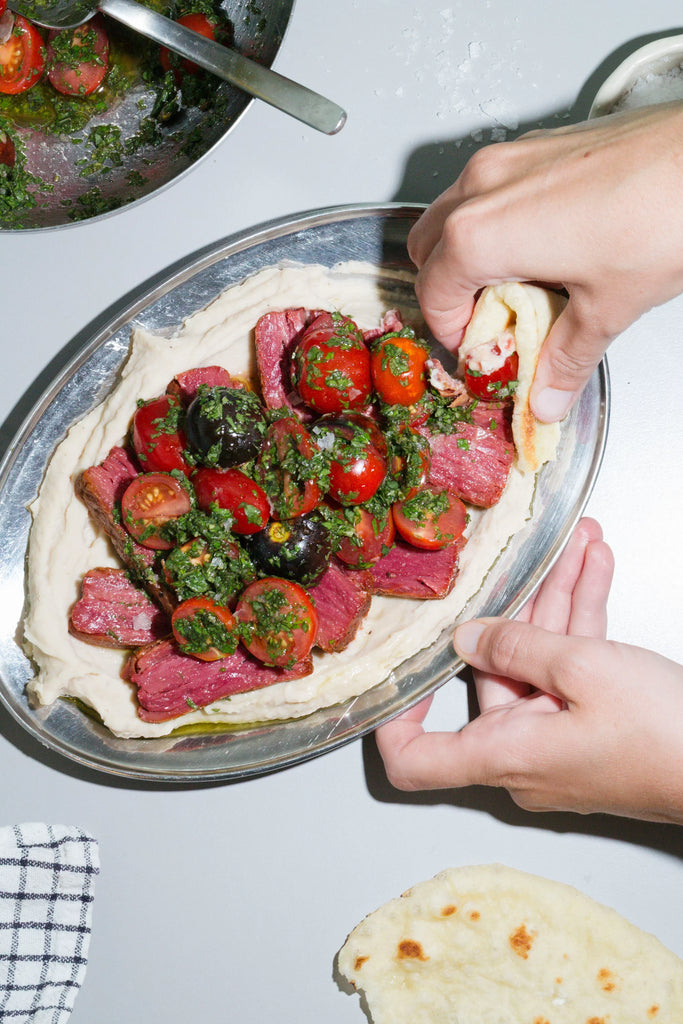 Juicy Marbles Lamb on Creamy Bean Puree with Herby Marinated Tomatoes